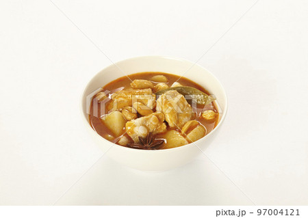 Chicken Massaman Curry on white bowl. Chicken Massaman Curry on white bowl. 97004121