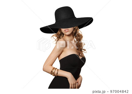 Gorgeous Woman Wearing Black Dress and bkack broad brim hat Isolated on White background. Gorgeous Woman Wearing Black Dress and bkack broad brim hat Isolated on White background. 97004842
