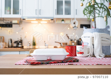 Food delivery service containers on table white scandi festive kitchen in christmas decor. Eve New year, saving time, too lazy to cook, hot order, disposable plastic box in fairy light. mock up 97007110