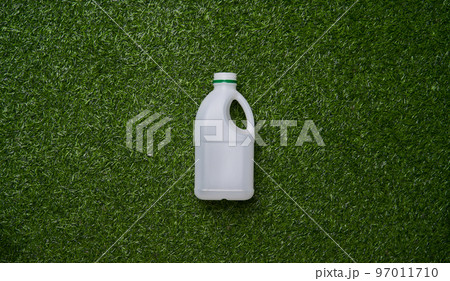 Plastic collected for recycling on green grass background. 97011710