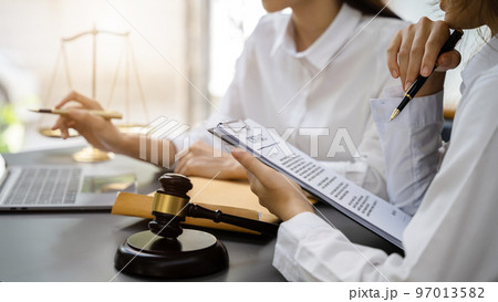 Lawyer or judge consult haveing team meeting at law office. Law and Legal services concept. Lawyer or judge consult haveing team meeting at law office. Law and Legal services concept. 97013582