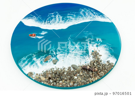 Resin art painting. Epoxy art with ocean waves, boat and stone beach. 97016501