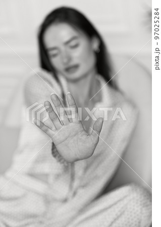 woman showing stop gesture. black and white woman showing stop gesture. black and white 97025284