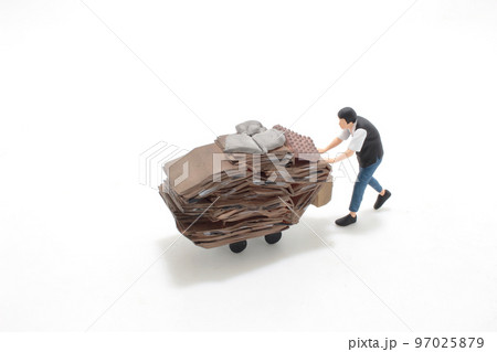 the Elderly scavenger with cardboard on trolley 97025879