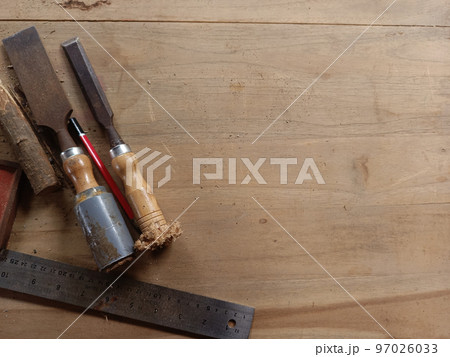 Carpenter wood working tools laying on wooden table. Industrial wood working materials. Carpenter wood working tools laying on wooden table. Industrial wood working materials. 97026033