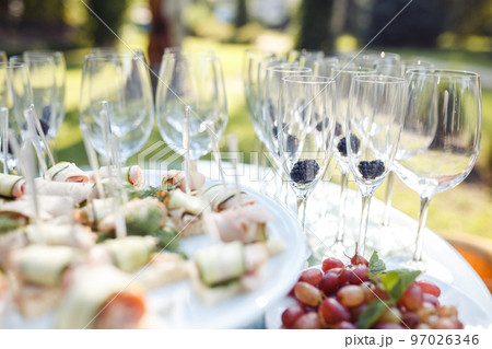 Champagne glasses on gold background. Party and holiday celebration concept 97026346