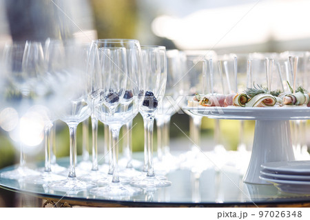 Champagne glasses on gold background. Party and holiday celebration concept 97026348