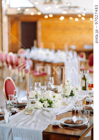 Beautiful table setting for a party, wedding reception or other festive event. Banquet setting, glasses, plates. 97027483