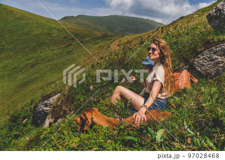 Mother Son and Vizsla Dog Resting in Mountains Mother Son and Vizsla Dog Resting in Mountains 97028468