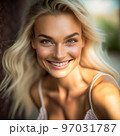 younf blonde woman smiling in summer day 97031787