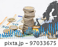 Pile of coins on euro banknotes and graph chart. High electricity and energy market prices concept 97033675