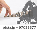 Fingers step on a stack of coins and Europe map. The concept of the energy crisis 97033677