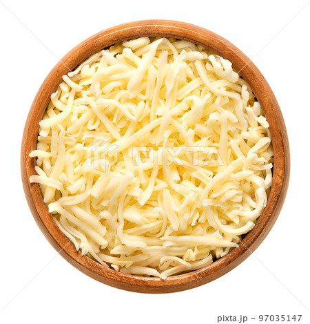Shredded mozzarella cheese, in a wooden bowl. Grated low-moisture part-skim mozzarella, an Italian cheese, made of pasteurized cow milk, rolled in starch to avoid sticking. Used for pizza and pasta. Shredded mozzarella cheese, in a wooden bowl. Grated low-moisture part-skim mozzarella, an Italian cheese, made of pasteurized cow milk, rolled in starch to avoid sticking. Used for pizza and pasta. 97035147