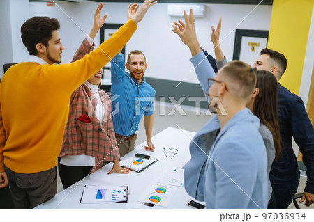 Young business people demonstrating unity with their own hands. Stack of hands. 97036934