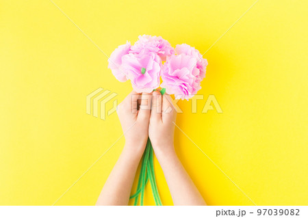 Easy paper craft with kids flowers. Mother's day. Hands. Happy birthday. 97039082