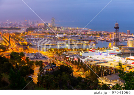 Aerial view of Barcelona on Mediterranean coast with seaport in evening Aerial view of Barcelona on Mediterranean coast with seaport in evening 97041066