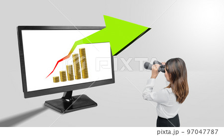 Asian businesswomen with binoculars looking at increasing graphs 97047787