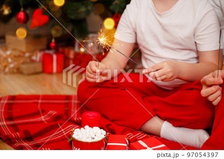 Merry Christmas. Happy family celebrating winter holiday at home. Merry Christmas. Happy family celebrating winter holiday at home. 97054397