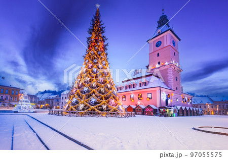 Brasov, Romania - Snowy Christmas Tree in downtown, touristic Transylvania. Brasov, Romania - Snowy Christmas Tree in downtown, touristic Transylvania. 97055575
