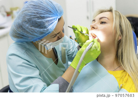 Dental health concept. female mouth on treatment in a dental clinic, Dental health concept. female mouth on treatment in a dental clinic, 97057683