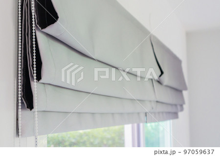 Roman blind curtain decoration in living room interior 97059637