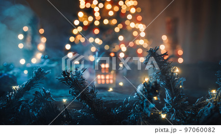 The little house with candle and tree as background The little house with candle and tree as background 97060082