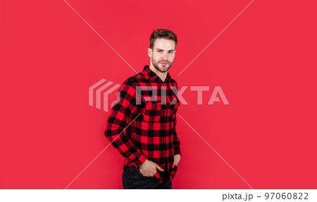 young handsome man in checkered shirt has bristle on face, style young handsome man in checkered shirt has bristle on face, style 97060822