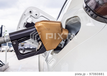 White car refueling at petrol gas station White car refueling at petrol gas station 97060881