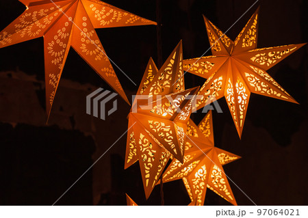 Decorative paper stars with traditional ornaments 97064021
