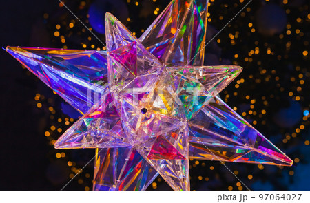 Decorative star with colorful inner illumination, close up 97064027