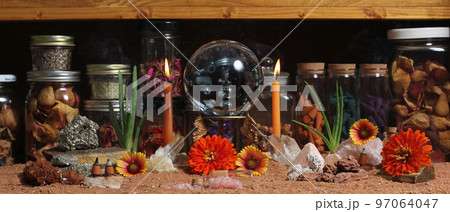 Crystal Ball With Candles and Chakra Stones on Australian Red Sand 97064047