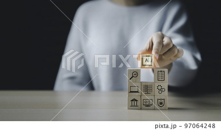 A woman's hand selects a wooden block with ai icon. Ai, the concept of artificial intelligence use analytics, automation, and an autonomous brain. business communication, computer connection 97064248