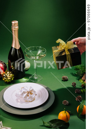 gift box with champagne, Christmas decorations and meringue 97066649