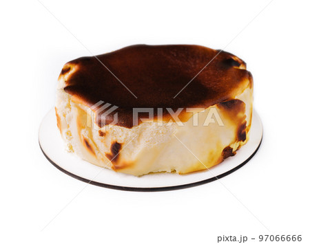 San sebastian cheesecake on plate isolated 97066666