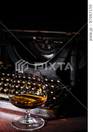 Cognac glass with an old typewriter Cognac glass with an old typewriter 97067150