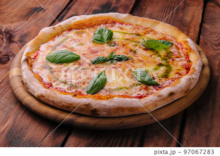 Homemade Pizza Italian margherita on wood Homemade Pizza Italian margherita on wood 97067283
