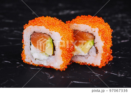 Sushi Roll California on black stone 97067336