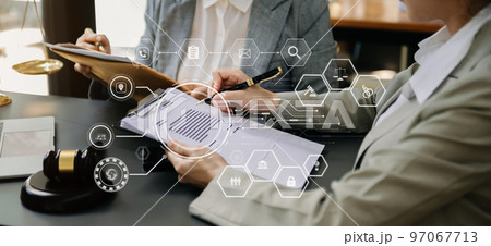 justice and law concept.Male judge in a courtroom the gavel, working with smart phone and laptop and digital tablet computer on black table justice and law concept.Male judge in a courtroom the gavel, working with smart phone and laptop and digital tablet computer on black table 97067713
