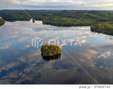 aerial footage couple Kayaking Boat tour on lake Ragnerudssjoen in Dalsland Sweden beautiful nature forest pinetree aerial footage couple Kayaking Boat tour on lake Ragnerudssjoen in Dalsland Sweden beautiful nature forest pinetree 97069740