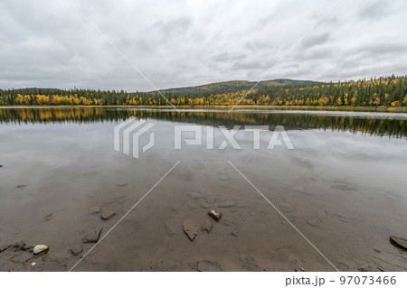 camping caravan near river autumn fall landscape along Ammarnas National Park in Lapland Sweden 97073466