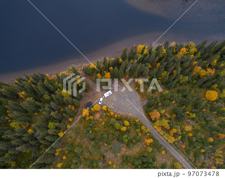 aerial view camping caravan near river autumn fall landscape along Ammarnas National Park in Lapland Sweden aerial view camping caravan near river autumn fall landscape along Ammarnas National Park in Lapland Sweden 97073478