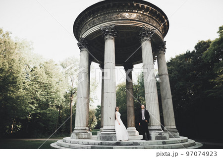 Caucasian happy romantic young couple celebrating their marriage. Outdoor Caucasian happy romantic young couple celebrating their marriage. Outdoor 97074923