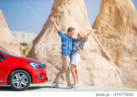 Family on car vacation. Happy couple travel by car in mountains.  97075600