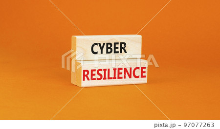 Cyber resilience symbol. Concept word Cyber resilience typed on wooden blocks. Beautiful orange table orange background. Business and cyber resilience concept. Copy space. 97077263