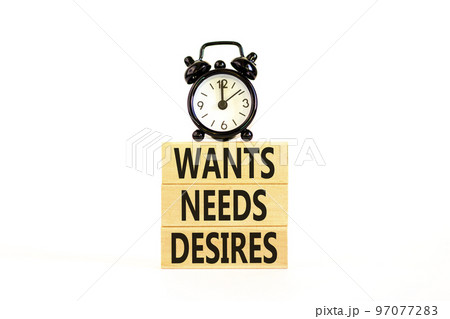 Wants needs and desires symbol. Concept words Wants Needs Desires on wooden blocks. Black alarm clock. Beautiful white background. Business, psychological wants needs and desires concept. Copy space. Wants needs and desires symbol. Concept words Wants Needs Desires on wooden blocks. Black alarm clock. Beautiful white background. Business, psychological wants needs and desires concept. Copy space. 97077283