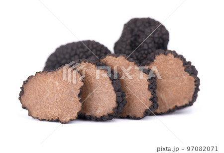 Black truffles isolated on a white background. Fresh sliced truffle. Delicacy exclusive truffle mushroom. Piquant and fragrant French delicacy. Clipping path. Black truffles isolated on a white background. Fresh sliced truffle. Delicacy exclusive truffle mushroom. Piquant and fragrant French delicacy. Clipping path. 97082071