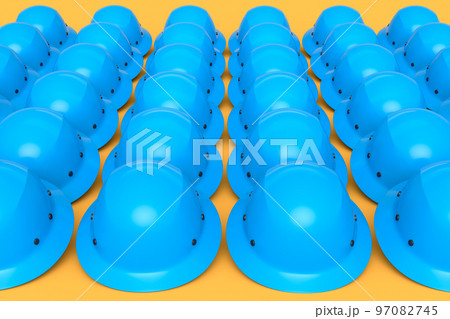 Set of safety helmets or hard caps for carpentry work in row on yellow Set of safety helmets or hard caps for carpentry work in row on yellow 97082745