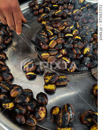 Fried chestnuts on the street. Street food. Roasted chestnuts Fried chestnuts on the street. Street food. Roasted chestnuts 97083352
