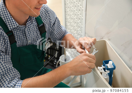 Woman with feather showing smooth skin after bikini epilation on pink background 97084155