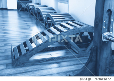 Interior of Gym with yoga wooden benches 97084872